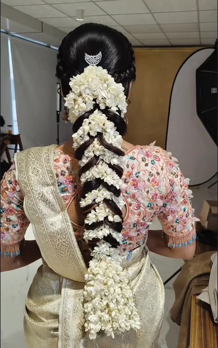 South Indian bridal braid wrapped the full length in jasmine garlands