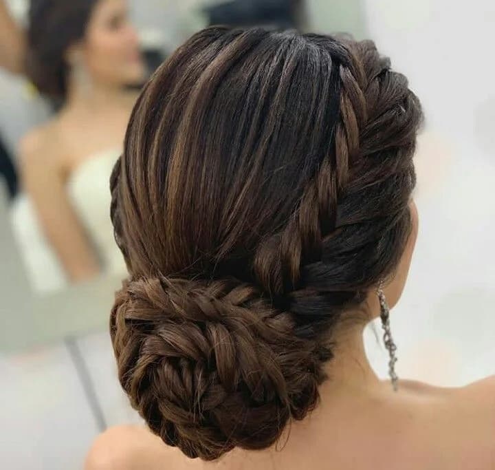 Braided crown wrapped into a textured low bun