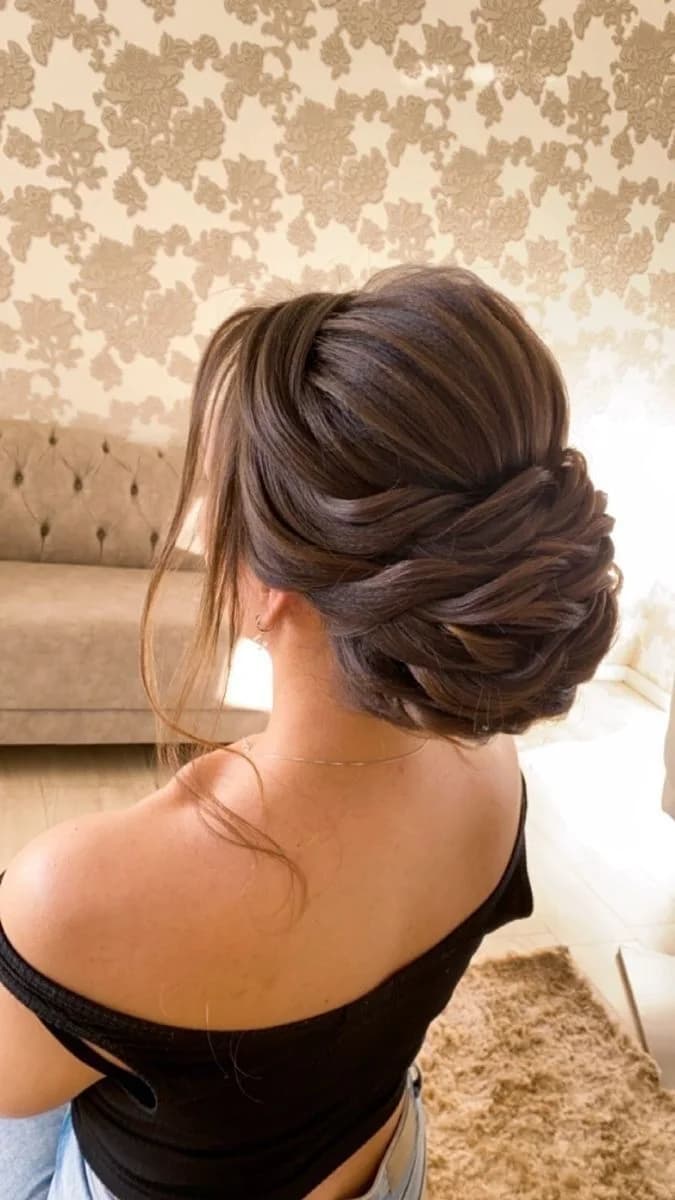 Twisted low chignon with soft face-framing strands