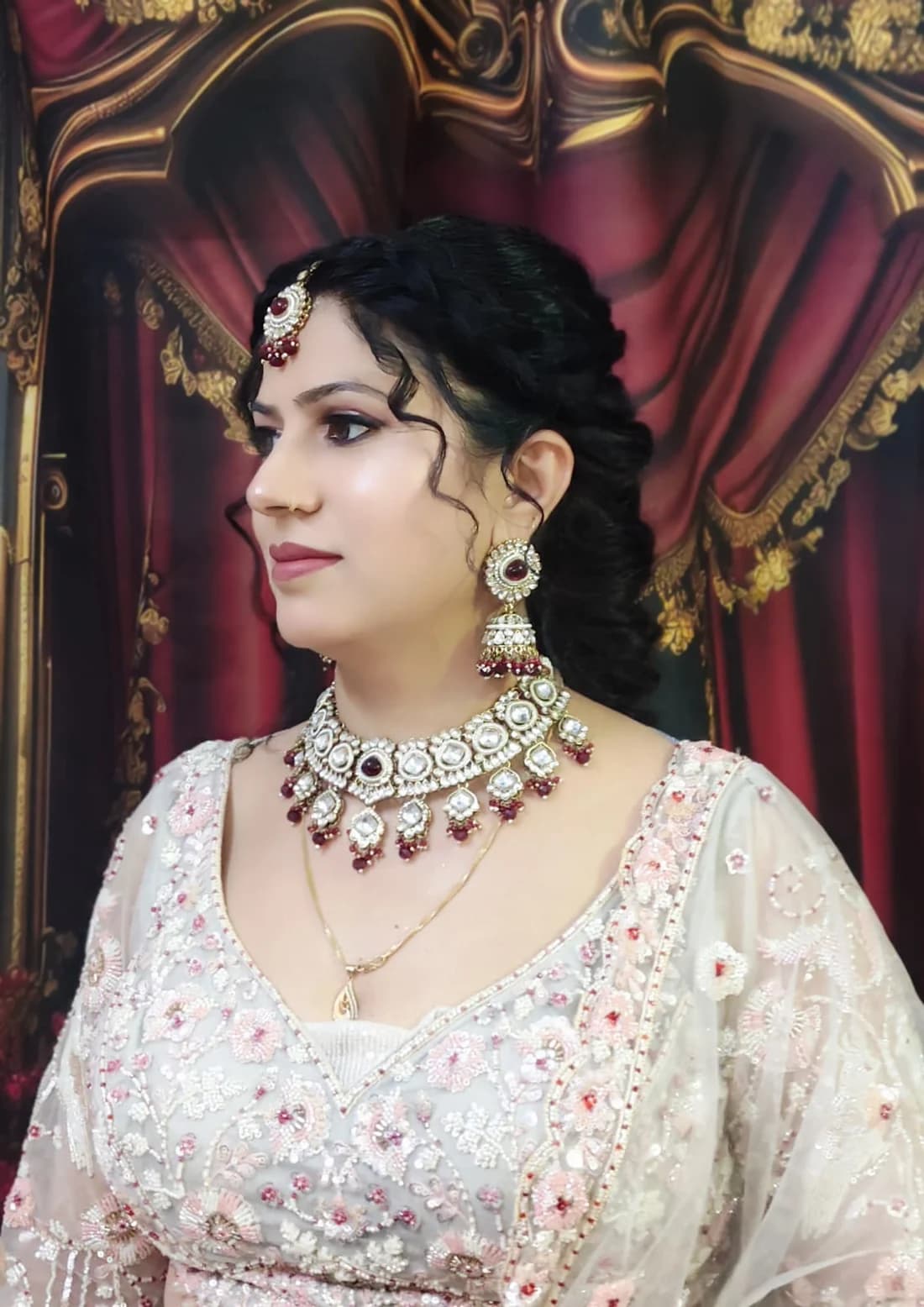 Occasion look with a soft smoky eye and maang tikka, worn with a blush embroidered saree
