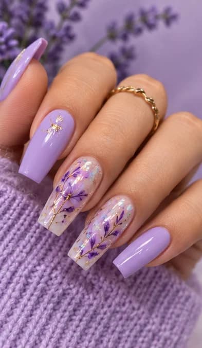 Lilac coffin nails with pressed purple flowers set under a glossy finish