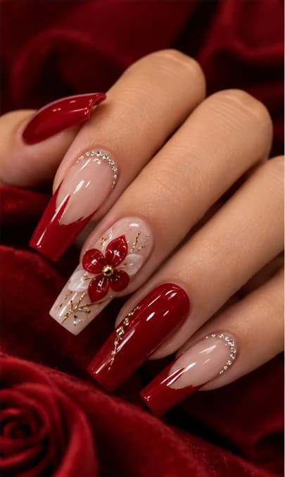 Deep red coffin nails with a three-dimensional flower and a crystal-set cuticle line