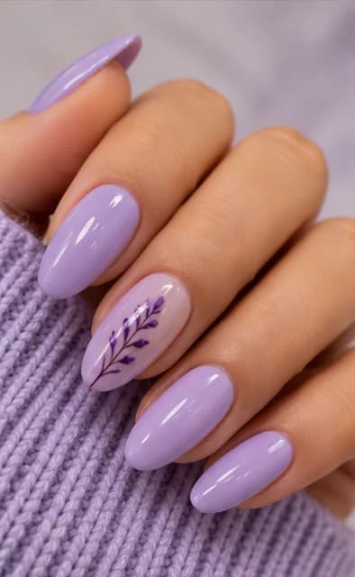 Lilac almond gel nails with a pressed lavender sprig on the accent nail